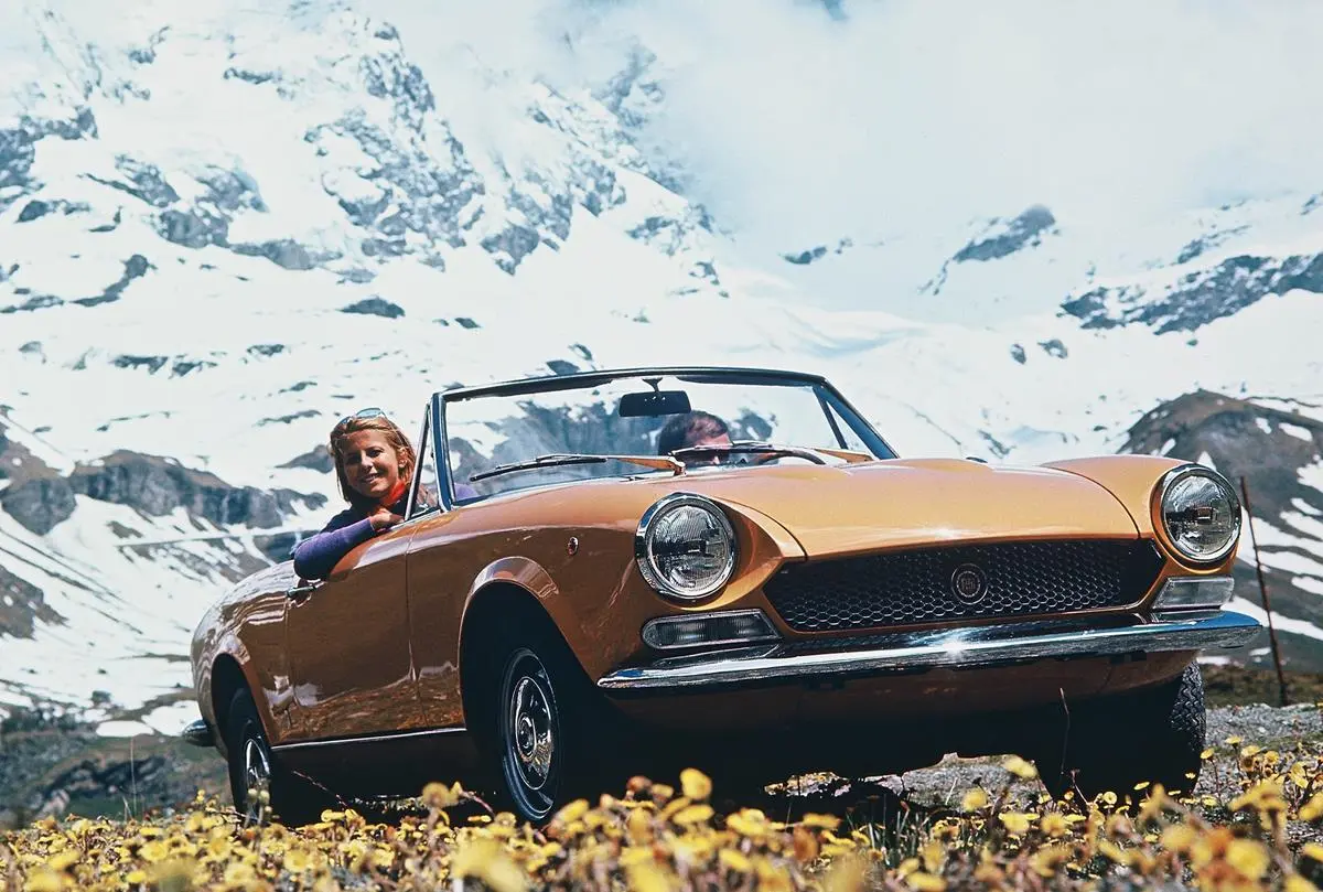 The classic Fiat 124 Sport Spider in an advertisement from the early 1970s
