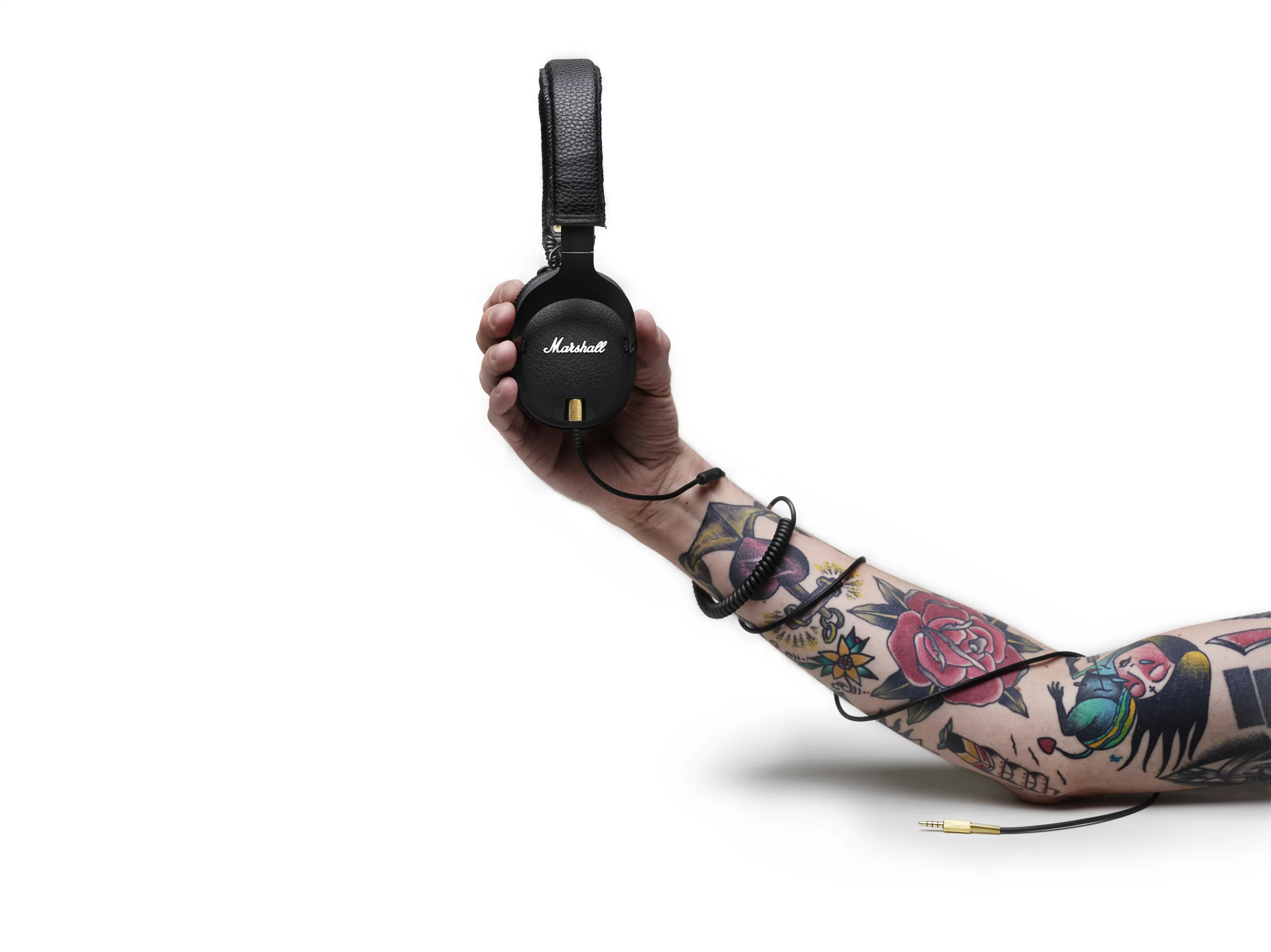 The detachable audio cable is coiled like a guitar cord