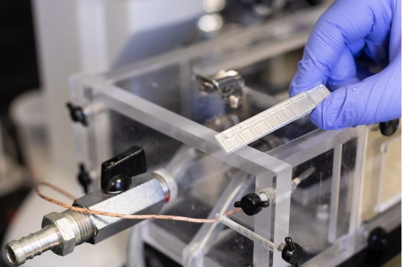 A scale model of the team's anti-frosting technology applied to a small sheet of untreated aluminum