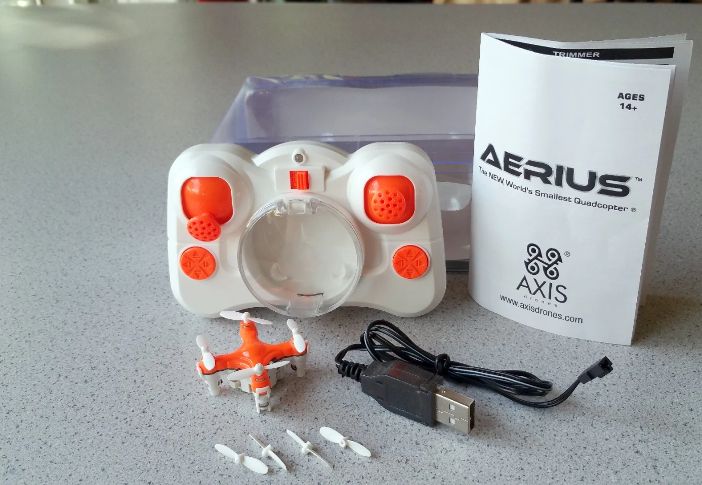 The Axis Drones Aerius quadcopter comes with a transmitter (with batteries), a USB cable, extra set of rotor blades, and instructions