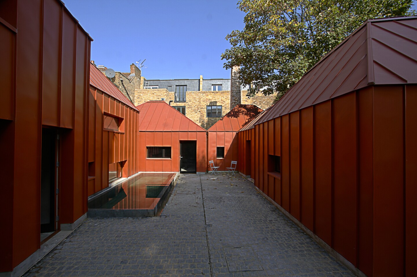 Tin House is built around a central courtyard which includes a small pond to help cool the area naturally