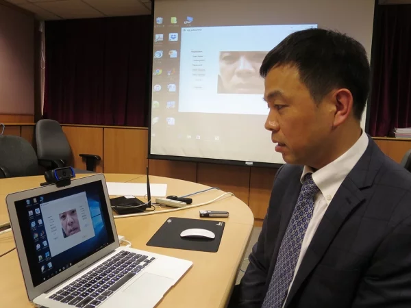 Professor Cheung Yiu-ming demonstrates his team's novel new lip reading password authentication system
