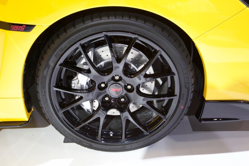 Airy wheels clad in S207-exclusive tires sit in front of specially-designed Brembo brakes.