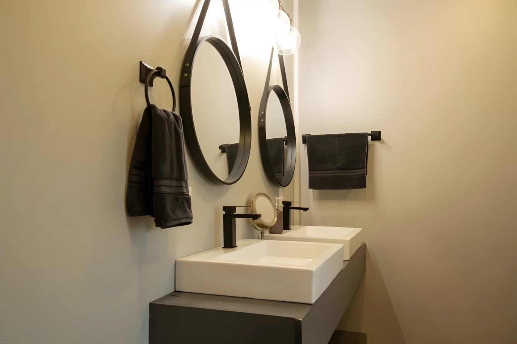 The Modern Side Stack's bathroom includes a shower, double sink, and a toilet