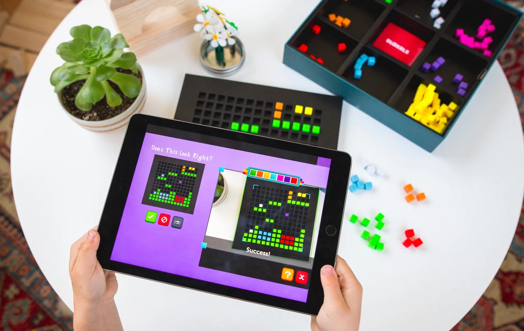 Bloxels lets children create their own video game by using plastic pixel blocks in a grid and importing it via an app