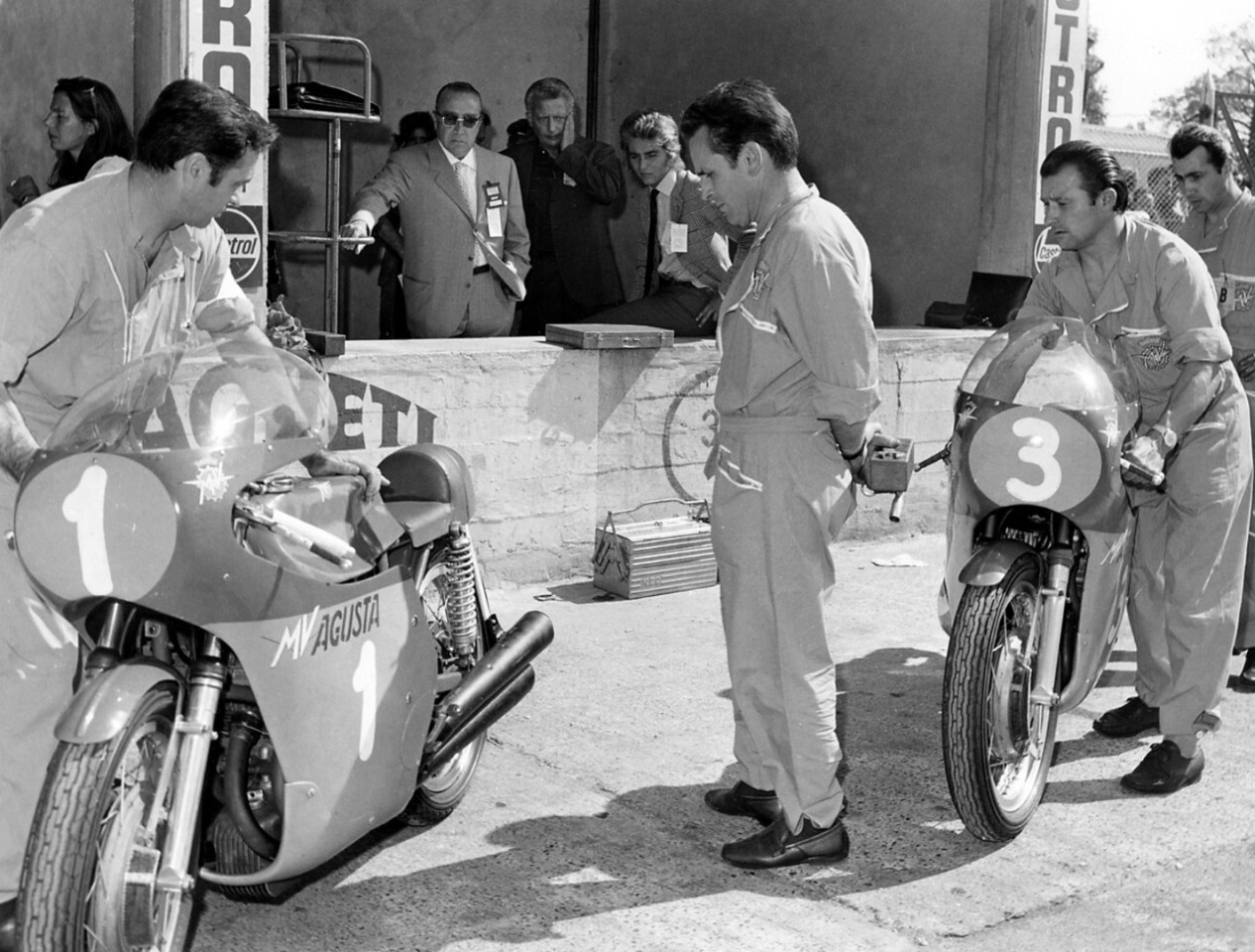The pit wall circa 1969 with company founder Count Domenico Agusta watching over his charges. MV Agusta motorcycles was created as a subsidiary of Costruzioni Aeronautiche Agusta Spa - a much larger aviation company founded by the Count's father and now part of helicopter design and manufacturing company AgustaWestland.