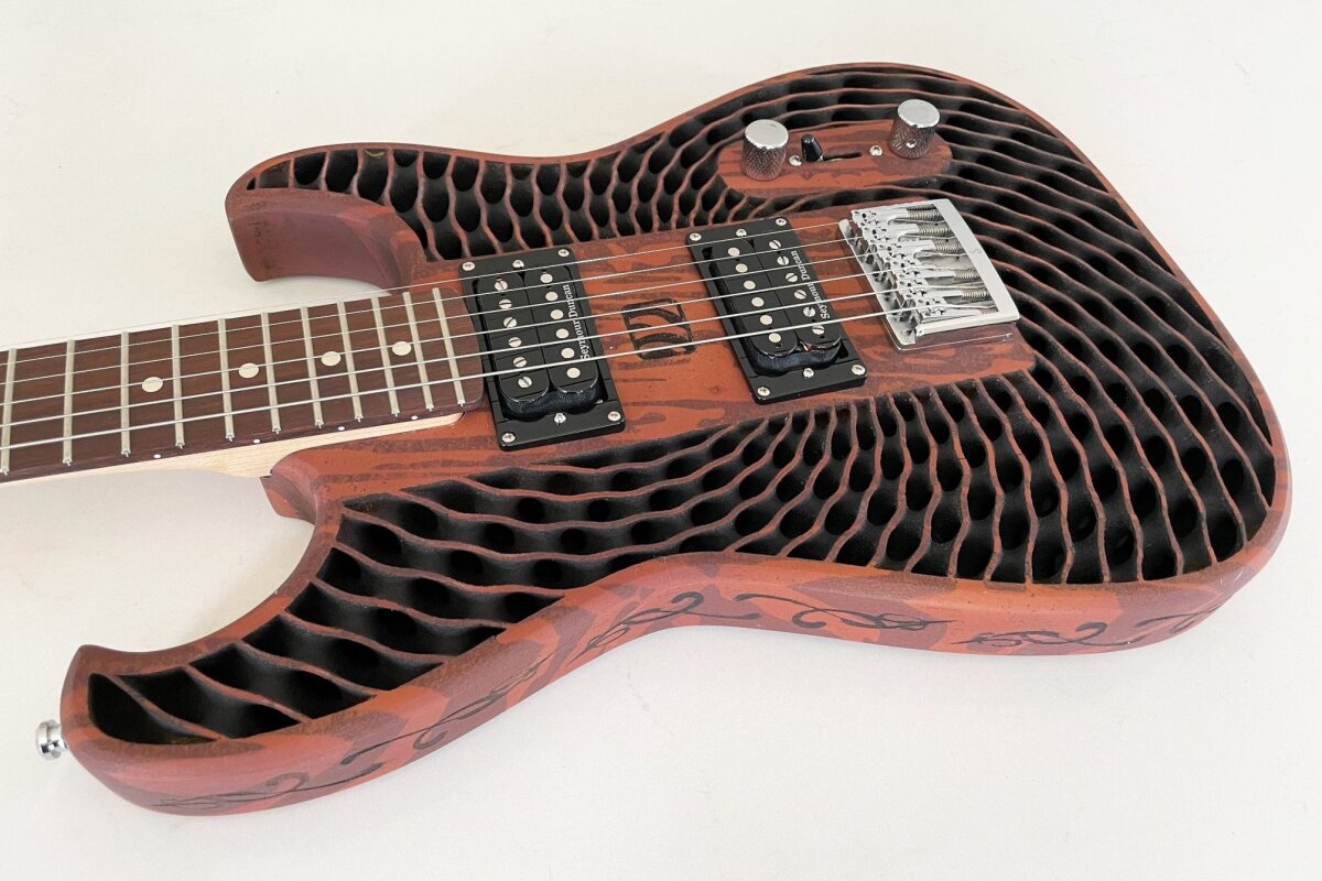 This 3Dprinted wood guitar is made from recycled sawdust