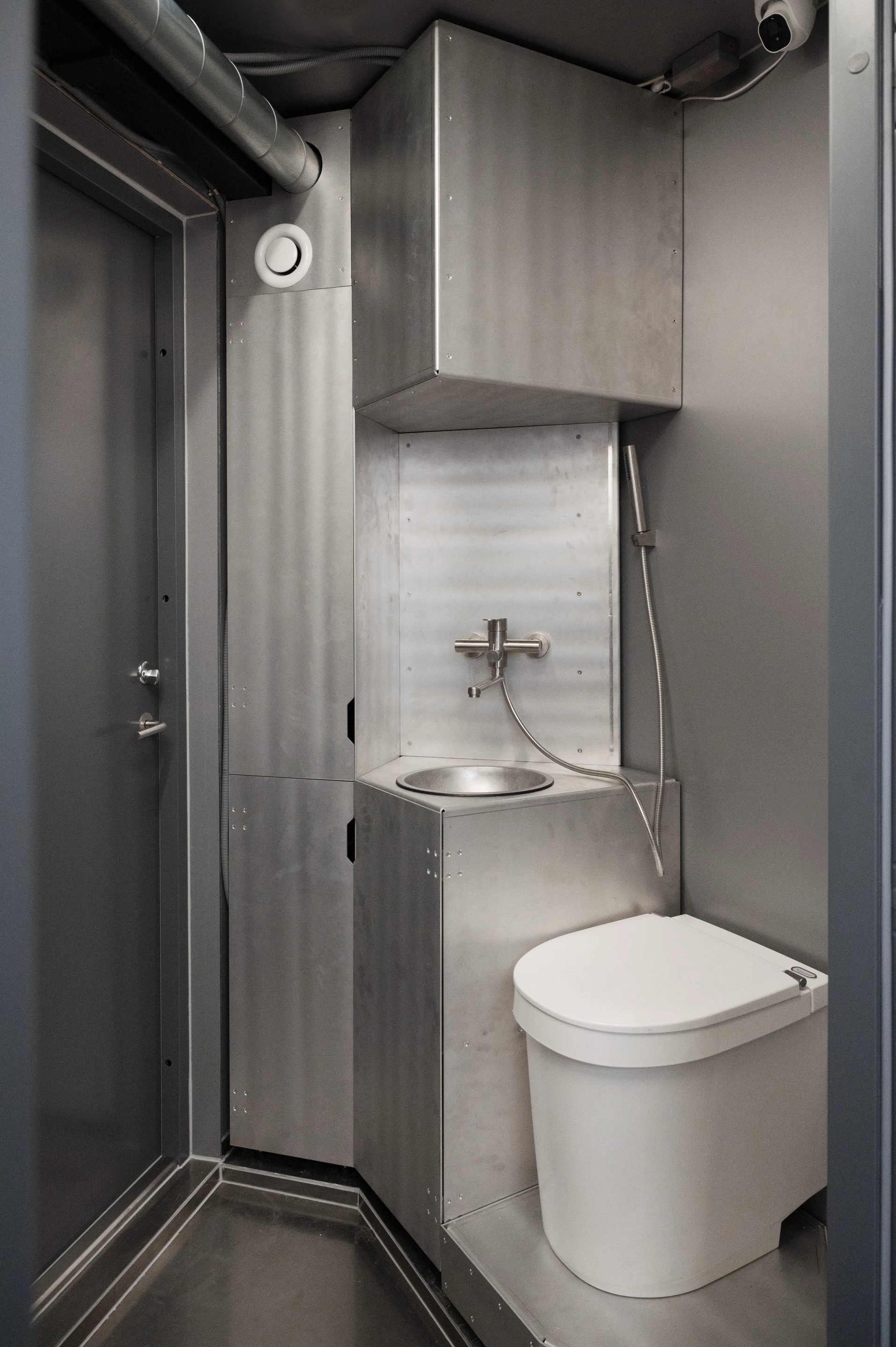 FLEXHab's "air lock" entrance doubles as a bathroom with a sink, shower, and toilet