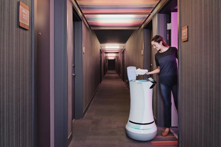 The SaviOne robot can deliver items to guests in hotel rooms