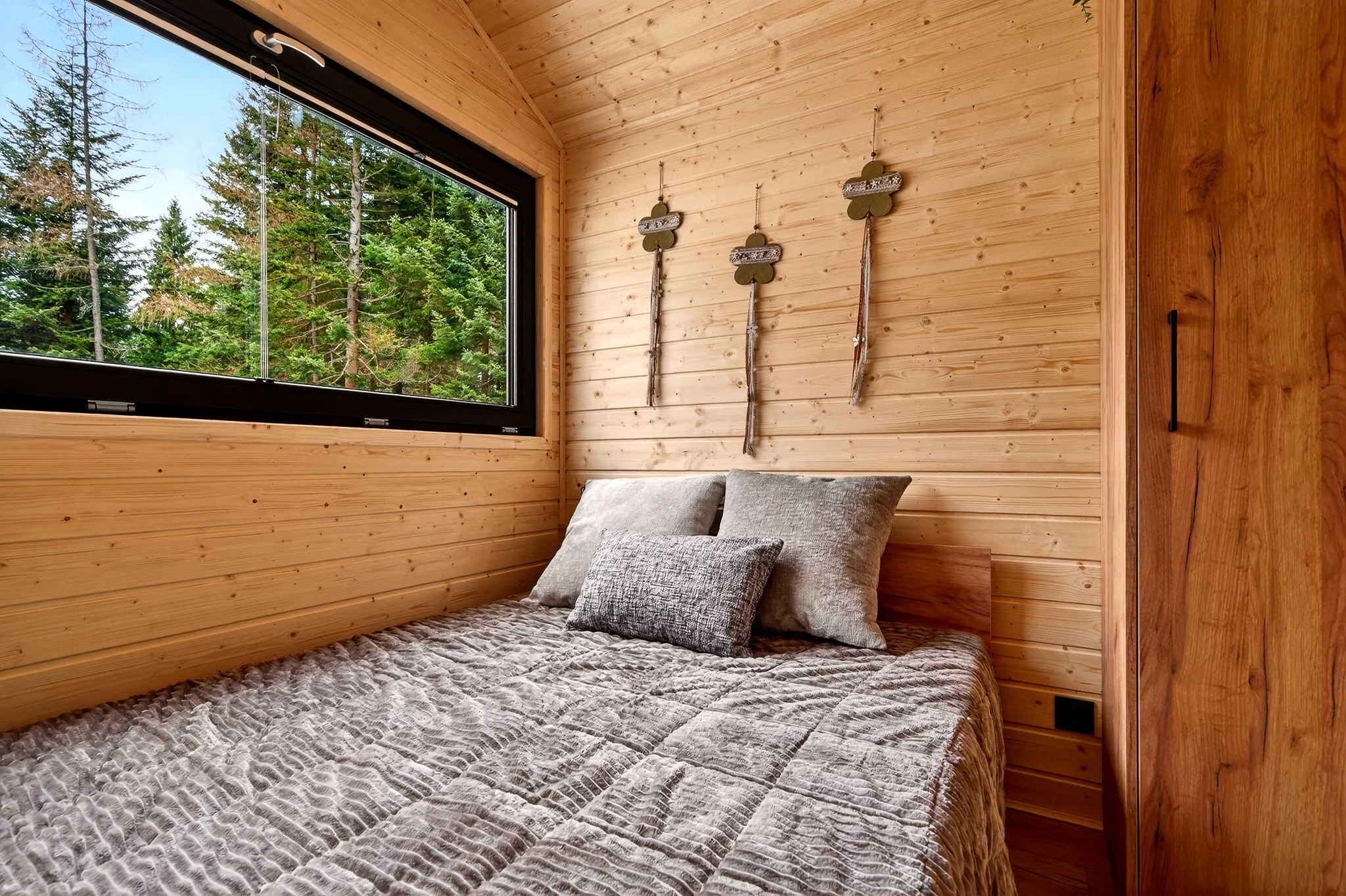 The Justine's bedroom contains a double bed and some storage space