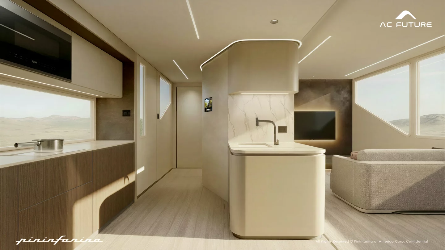 The interior has changed to incorporate a living room-like lounge setup next to the kitchen peninsula