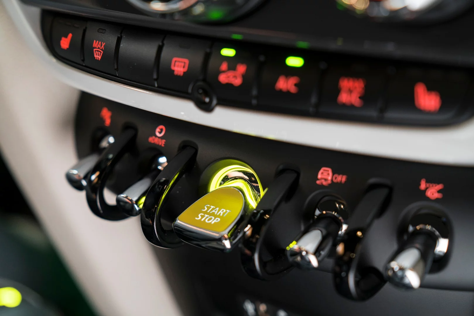 Aircraft-inspired console switches control many functions. Second from the left is the Efficiency Dynamics toggle, to the far right the head-up display deployment toggle