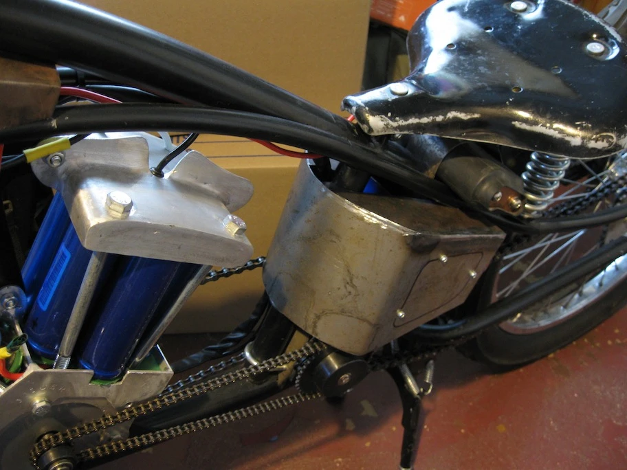 The extra batteries in the parallel string were housed in the "oil tank" area and under the seat