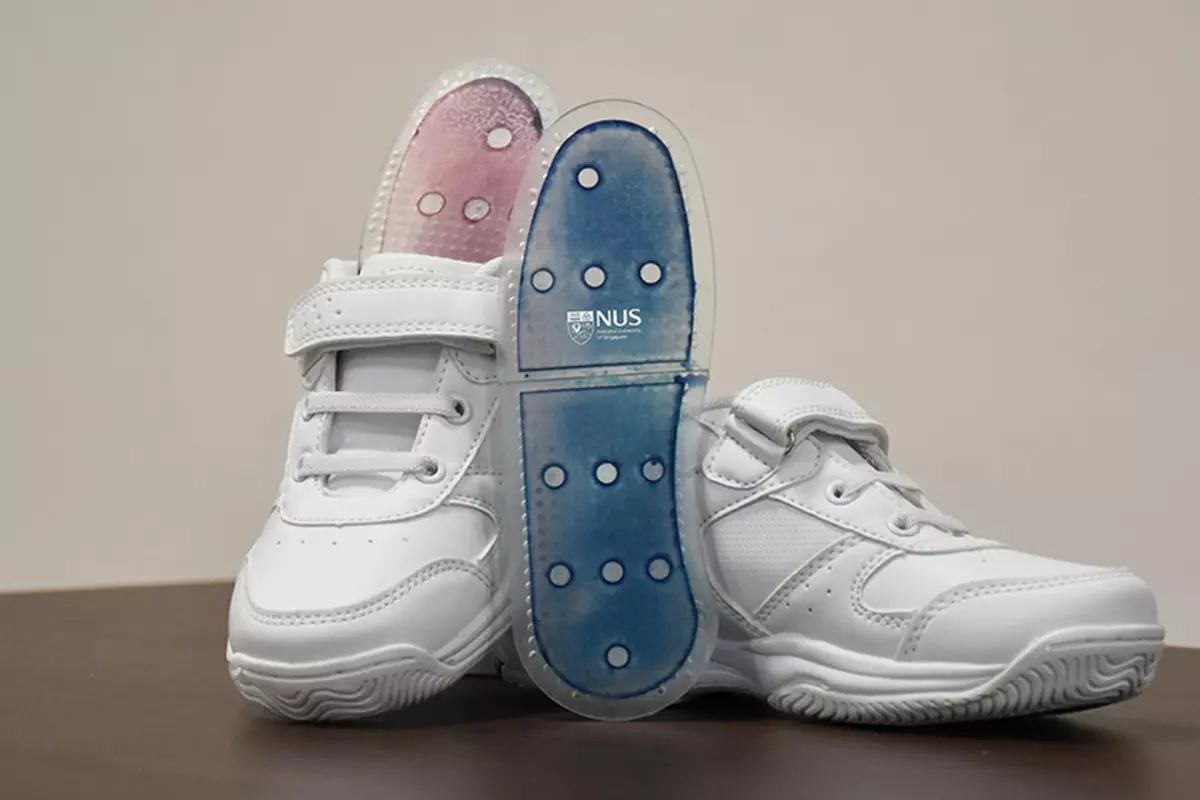 Shoe insoles made with the sweat-absorbing film, which change color from blue to pink as they absorb moisture