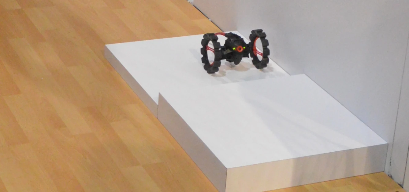 The Parrot all-terrain Minidrone will probably have trouble with your home staircase, but it makes easy work of this small step-up at Parrot's CES booth (Photo: C.C. Weiss/Gizmag)