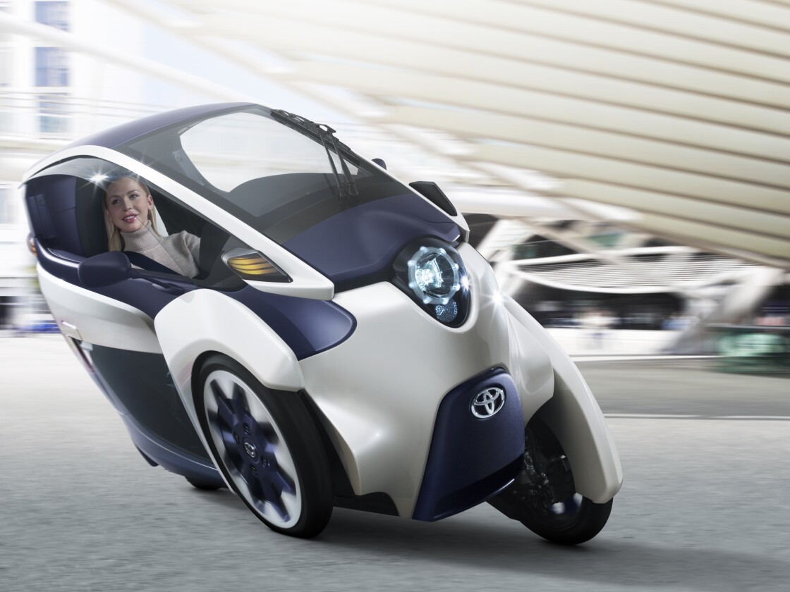 Toyota's i-ROAD is a fully-enclosed, two-seater, three-wheeled, fully-electric, Personal Mobility Vehicle (PMV)
