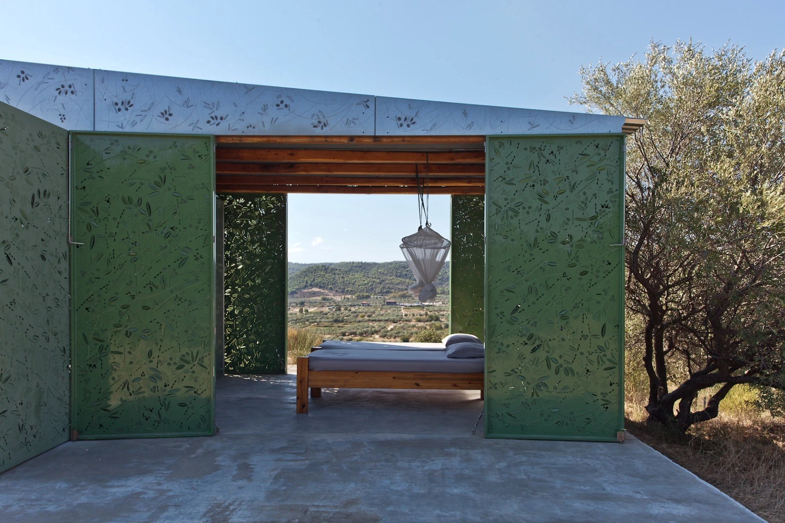 Being in an isolated spot, the Olive Tree House gets its power from a solar power array and it also features composting toilet