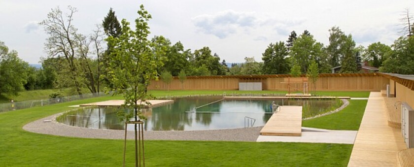 Features include a wading pool for toddlers, a separate pool with a sloping gravel beach, a water-slide, a 25-meter lap pool and a diving board (Photo: Helen Schneider)