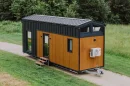 The Alan, by Craft House, is a mid-sized two-bedroom tiny house with a clever space-saving layout
