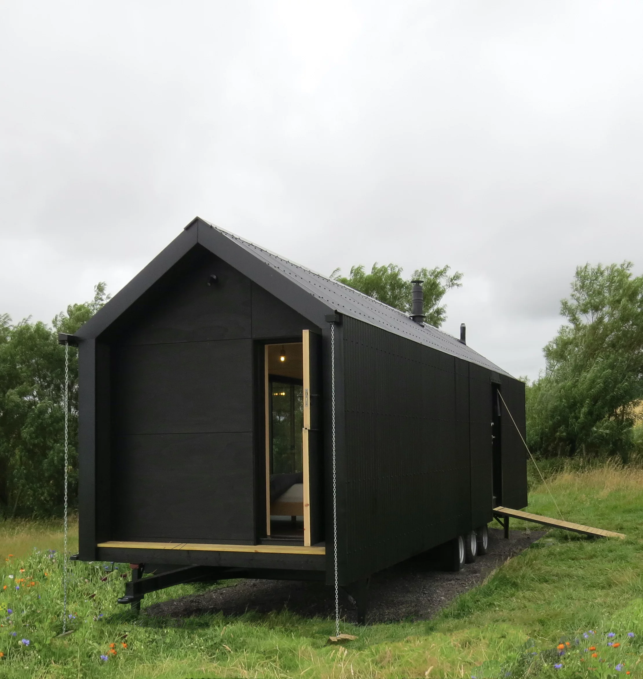 The Long Shed includes the main entrance, the sliding glass door, and a third door at the bedroom