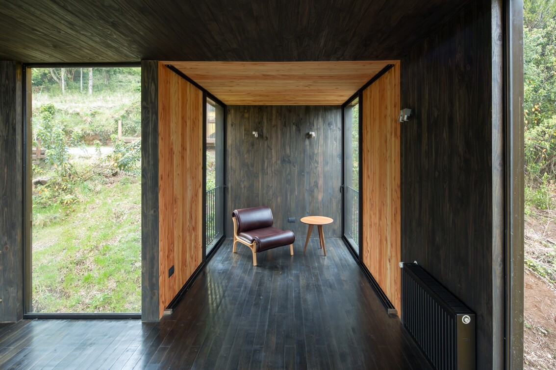 Yellow House modules joined together creating seperate nooks and rooms