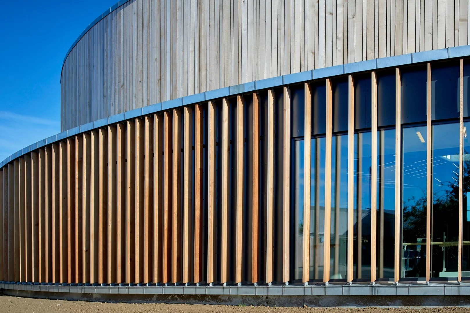 The facades on the hall and holiday homes are covered with larch wood