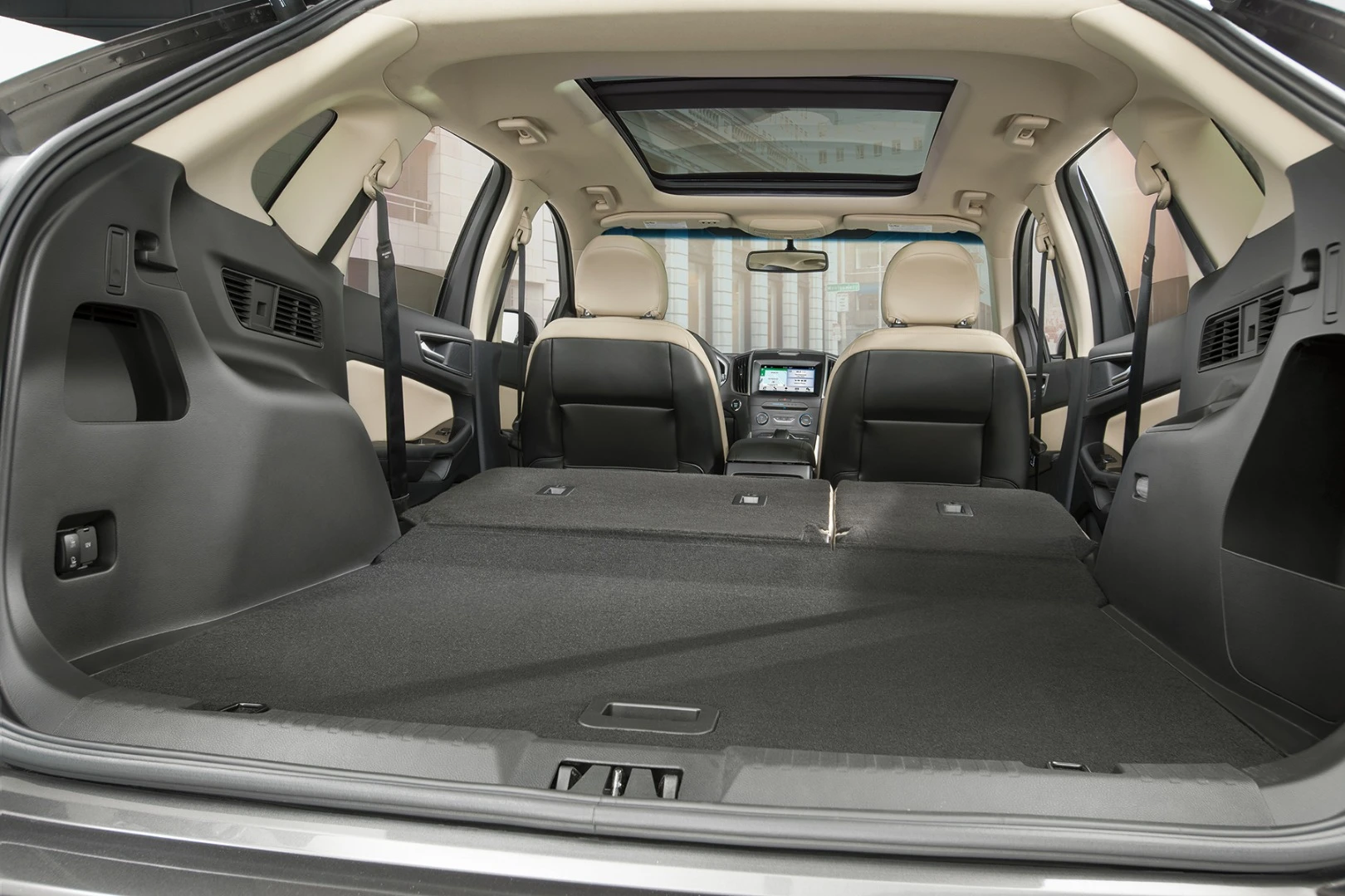 There are 39.2 cubic feet (1,110 liters) of cargo space behind the second row and that expands to a cavernous 73.4 cubes (2,078.5 liters) with the rear bench folded down