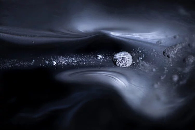 The Bullet by Anna Ulmestrand was the second place winner in the Intimate Landscapes category of the 2020 Close-up Photographer of the Year. It depicts an air bubble frozen inside an icicle, near an old abandoned mill.