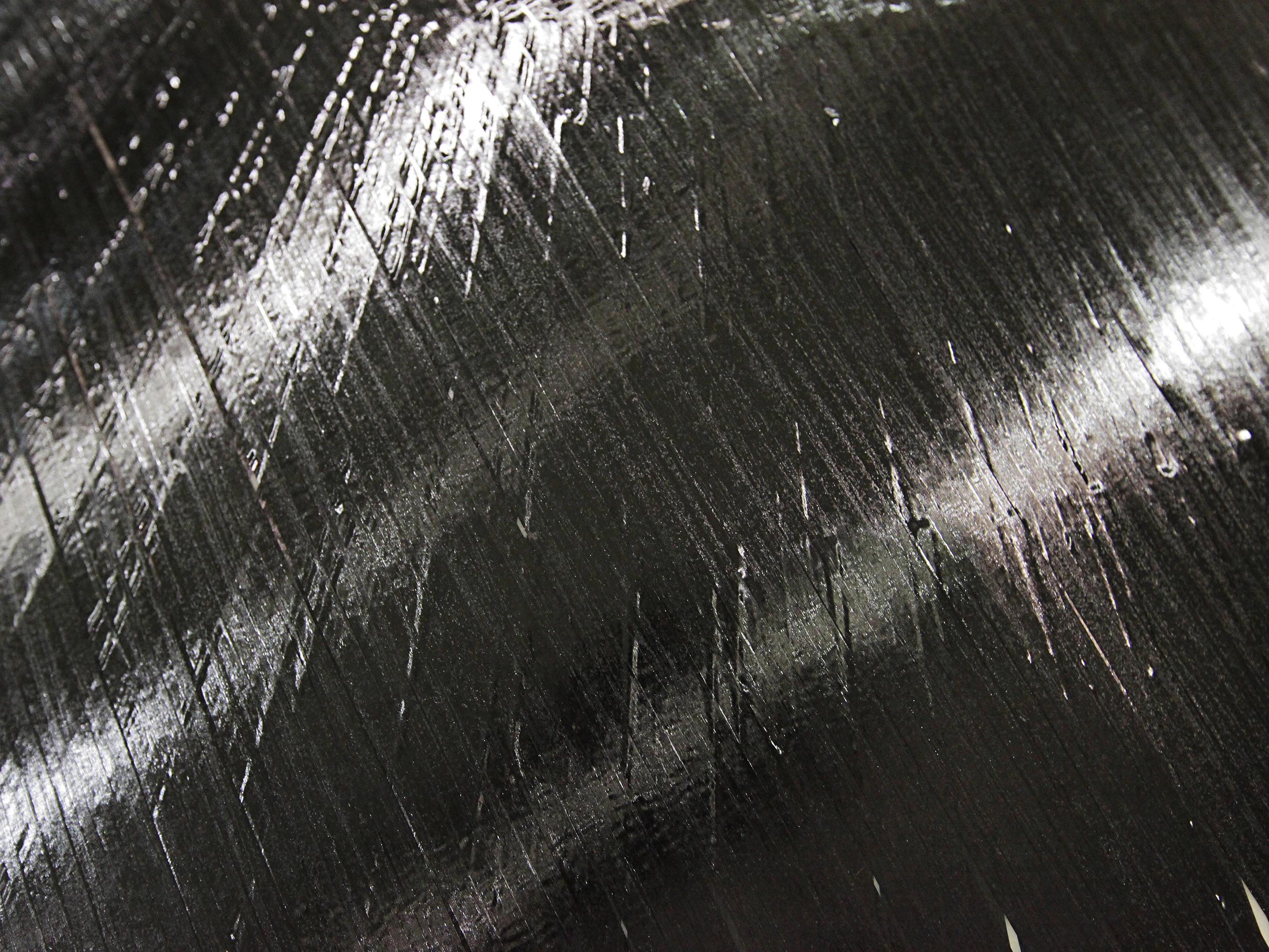 This closeup shows a sheet of carbon-fiber-and-epoxy ribbons created by ISAAC (Photo: NASA/David C. Bowman)