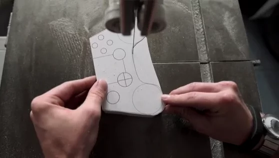 A model of the Ouya controller being cut to shape