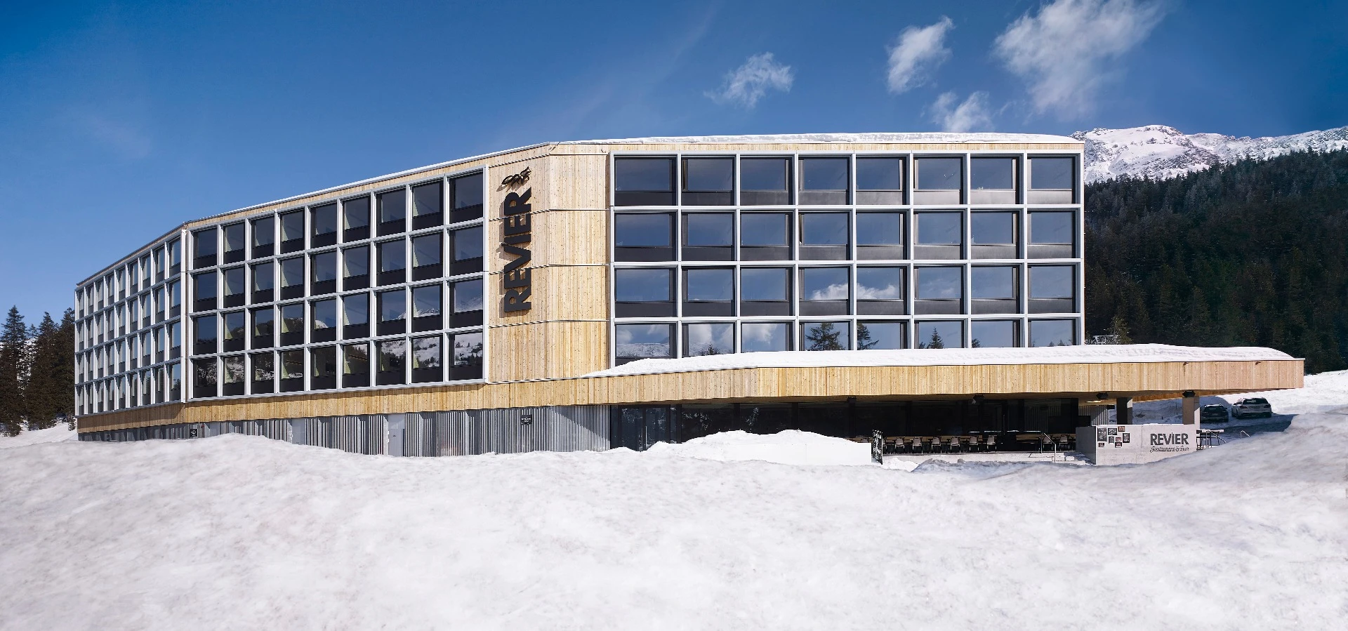 Each of the 96 rooms making up the four floors of the Revier Mountain Lodge was crafted from natural unfinished plywood and fabricated off site