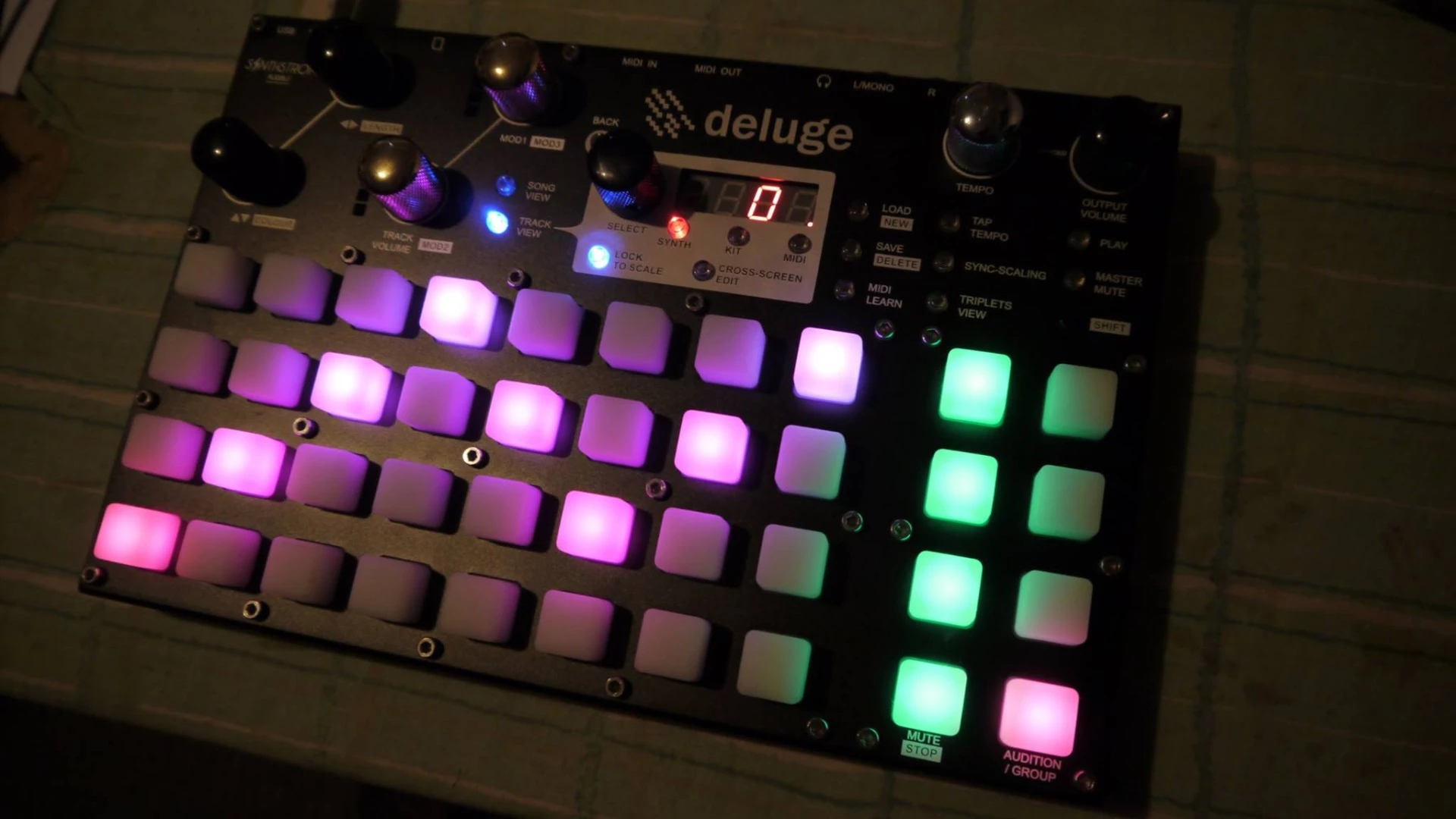 A Deluge prototype showing the full RGB pads and endless turn encoders with LED level meters