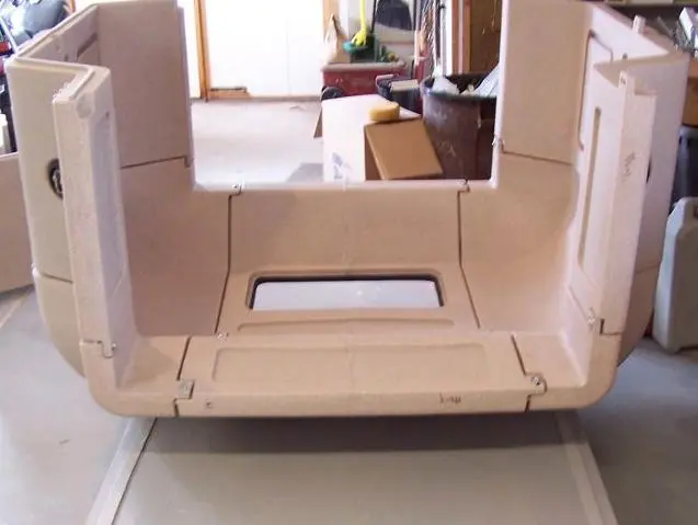 Several different panel types like corners and windows assemble together to create the full camper