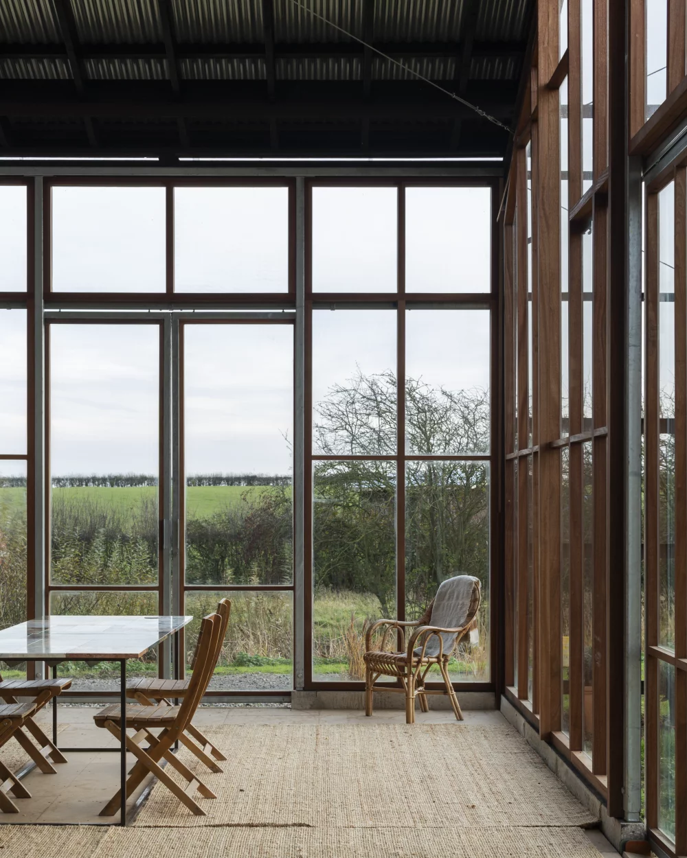 The interior of the Flat House features an abundance of windows, natural light and good airflow