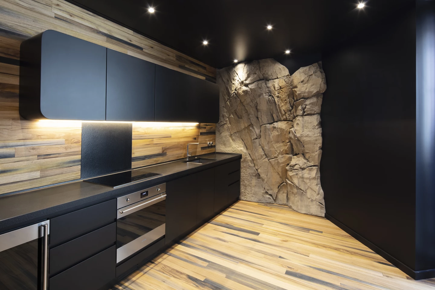 Villa Troglodyte's second floor features a kitchen and dining area, living room, and its master bathroom