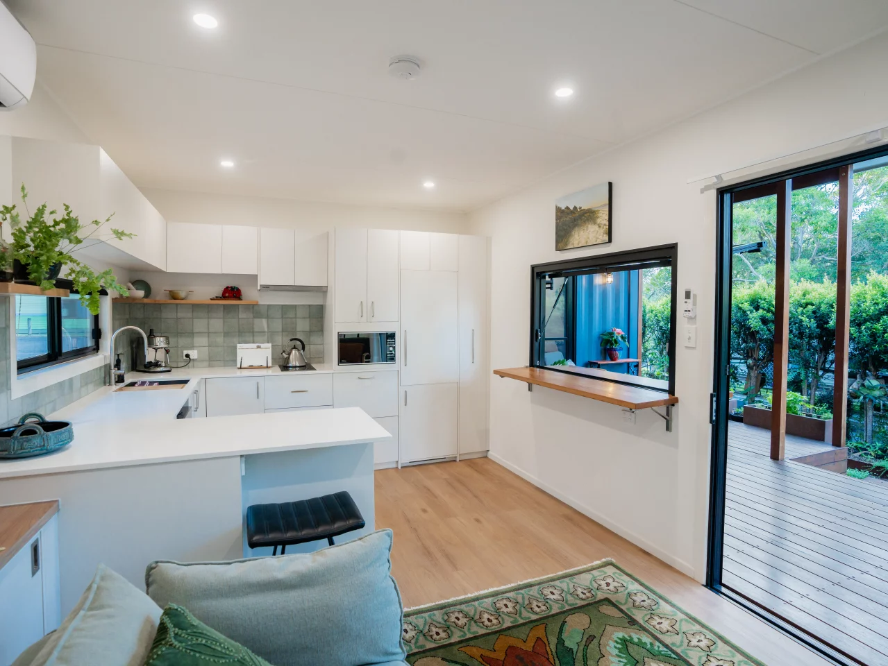 The Seaholme's kitchen includes a small breakfast bar-style seating area
