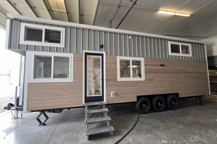 This tiny house, designed by Washington's Big Freedom Tiny Homes, has a length of 30 ft (9.14 m) and makes room for a small family
