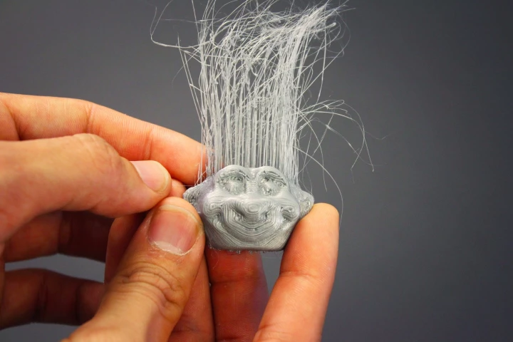 A troll doll head, with its own 3D-printed hair