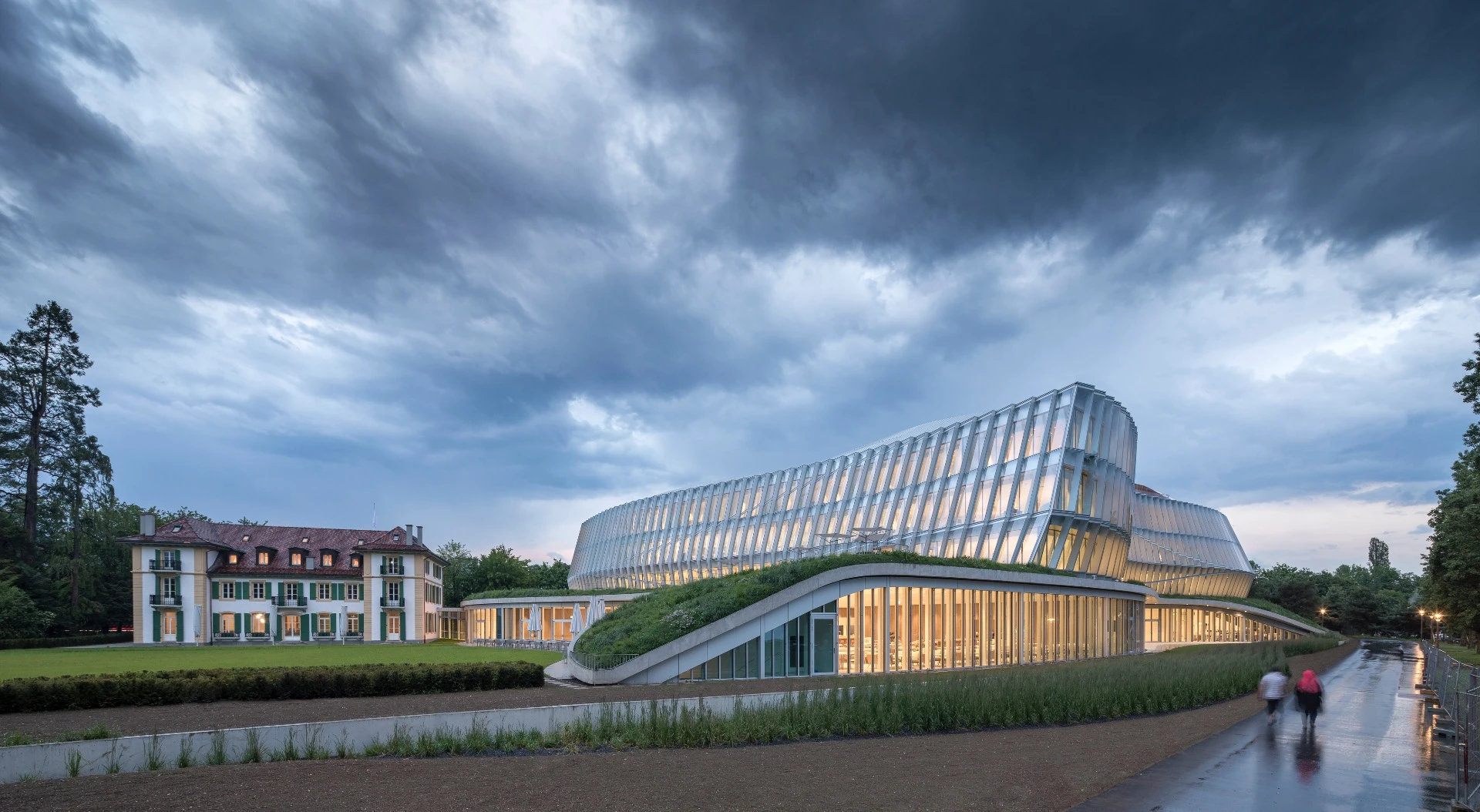 The Olympic House's glazed facade is meant to both reflect the IOC's commitment to transparency and emulate the movements of an athlete