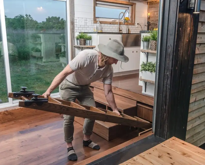 The Alpha's ladder and eight-person dining table is stored beneath the floor