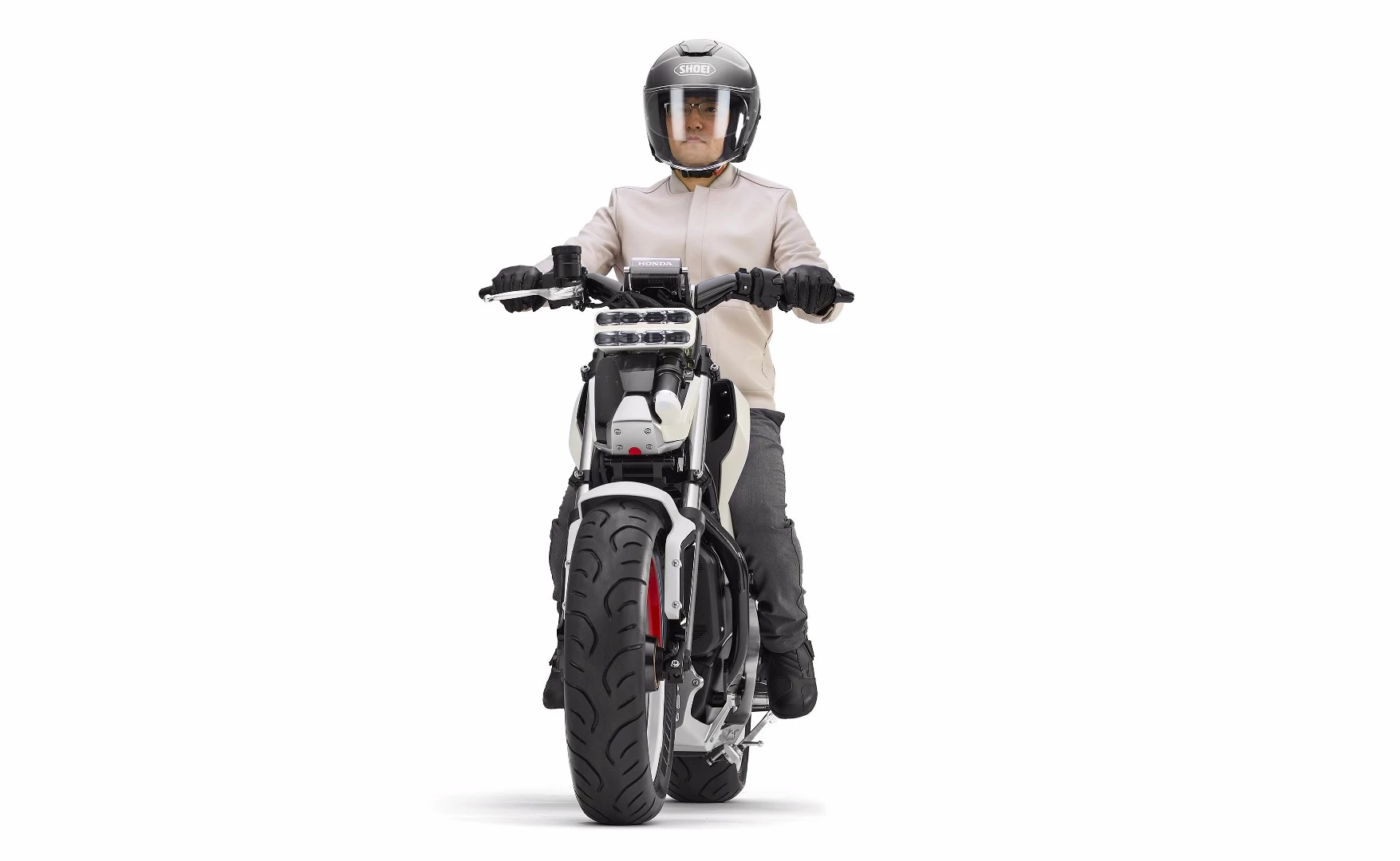 The Honda Riding Assist-e is an electric vehicle with a low center-of-gravity, a very low seat height, and a self-balancing technology which can be configured to intervene at very low speeds.