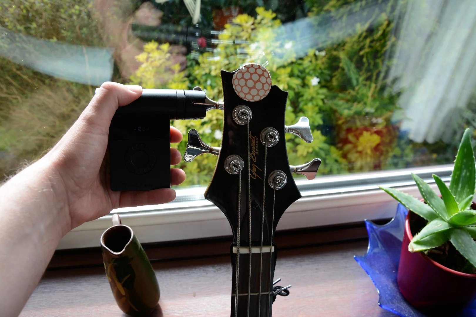 The OLED display and control wheel have been moved to one side of the Roadie Bass, so that players can see what's happening during a tune up