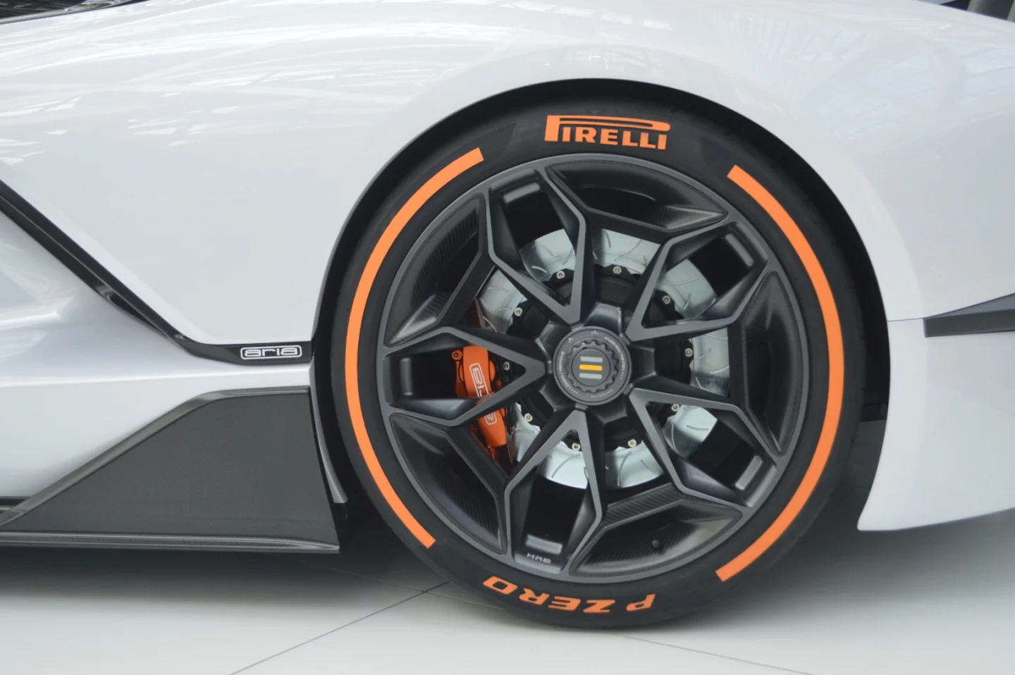 The FXE's exotic forged HRE center-lock wheels wrapped in high-performance Pirelli P Zero Trofeo R tires