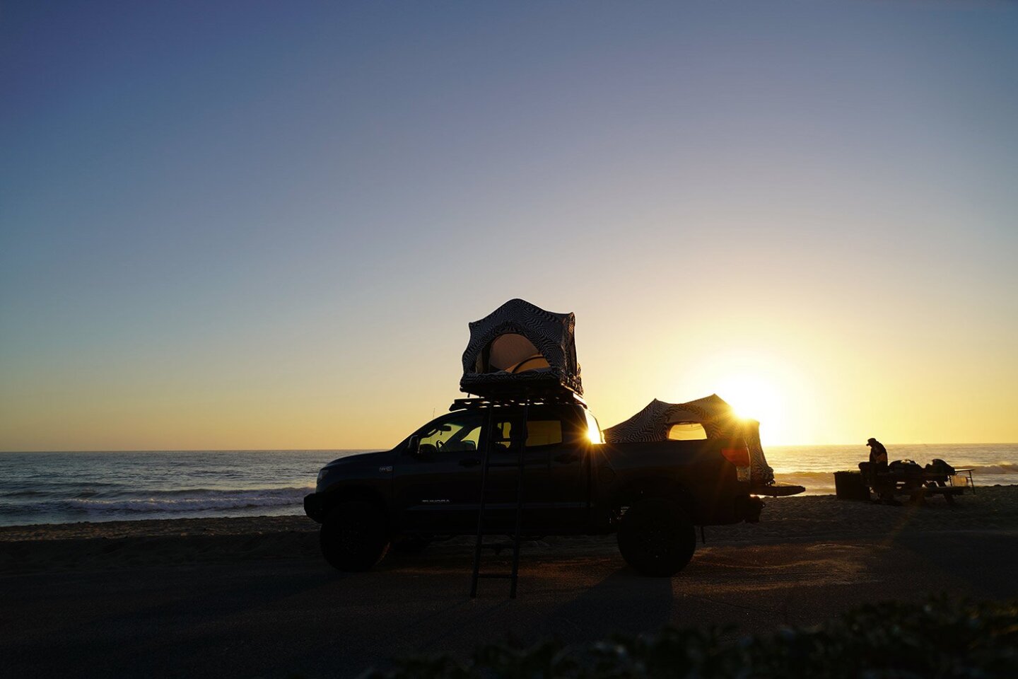 Drive a pickup truck and get a pair of Rev tents to make it a four-sleeper RV