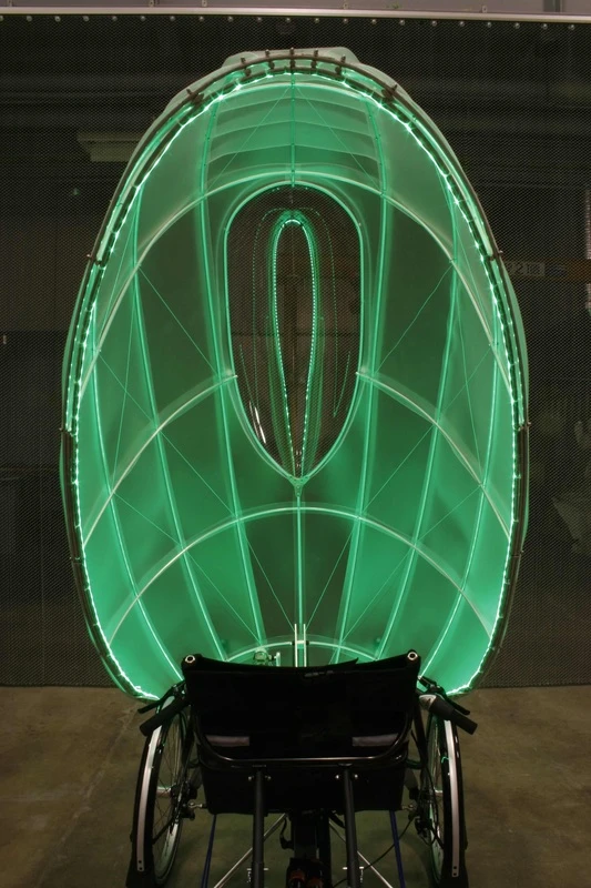 The shell tilts forward so a person can sit down and remain shielded from the cold, rain, or snow