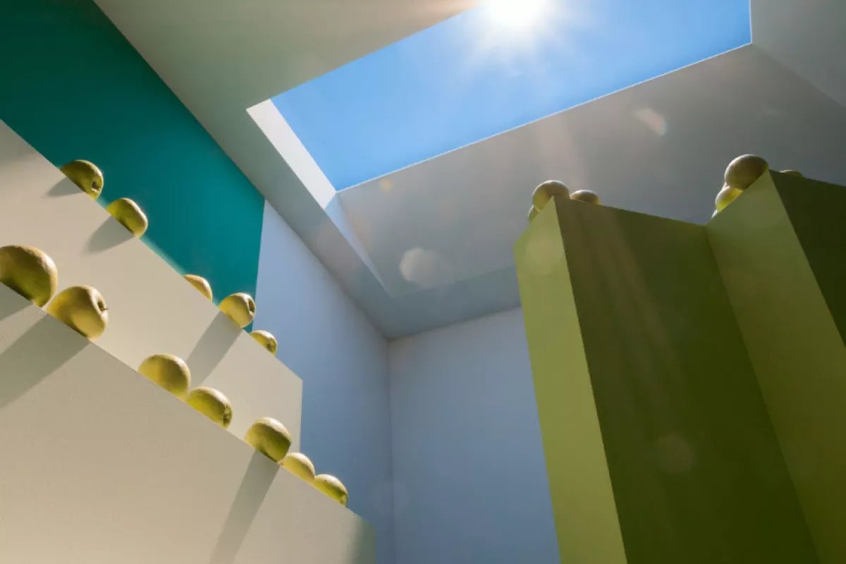 A complex optical system creates an almost 3D sensation of distance and space between the faux sky and the sun