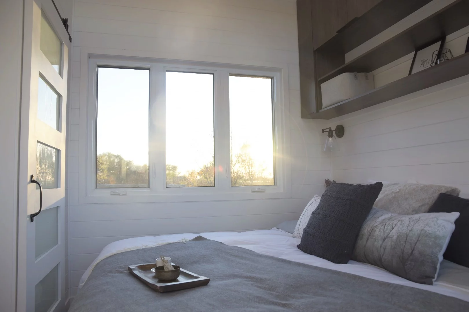 The Magnolia's main bedroom is accessed by sliding door