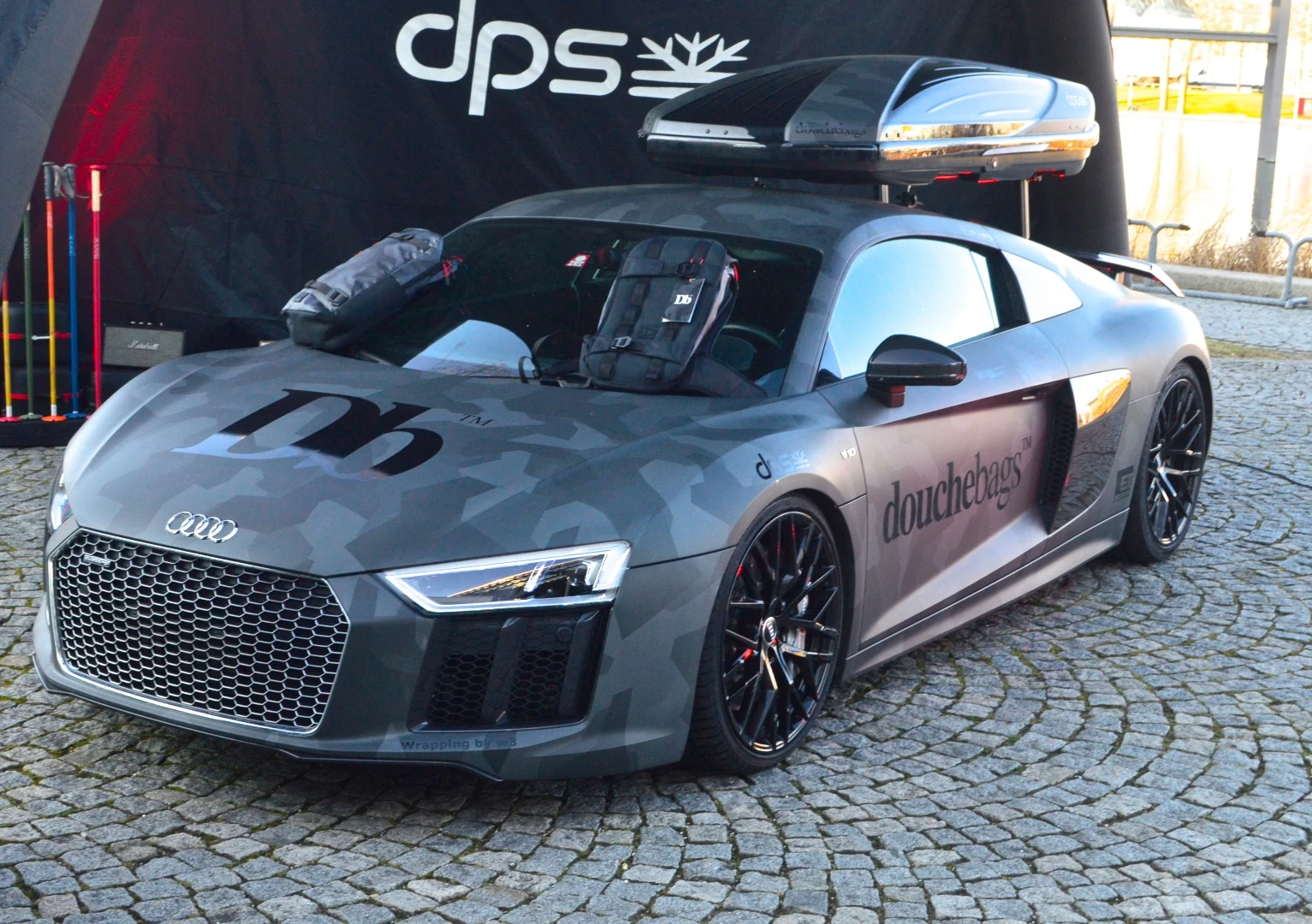 Douchebags attracts onlookers with a mountain-ready Audi R8
