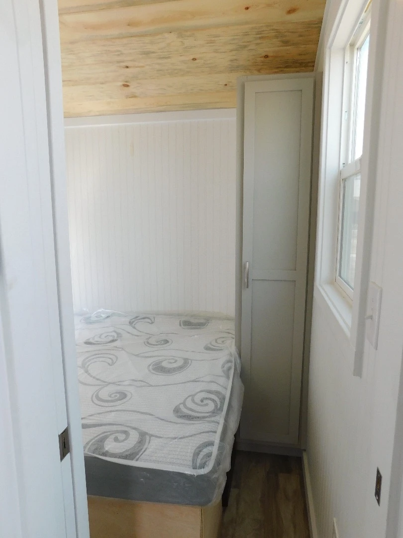 The Ozark's queen-sized bed has integrated storage space