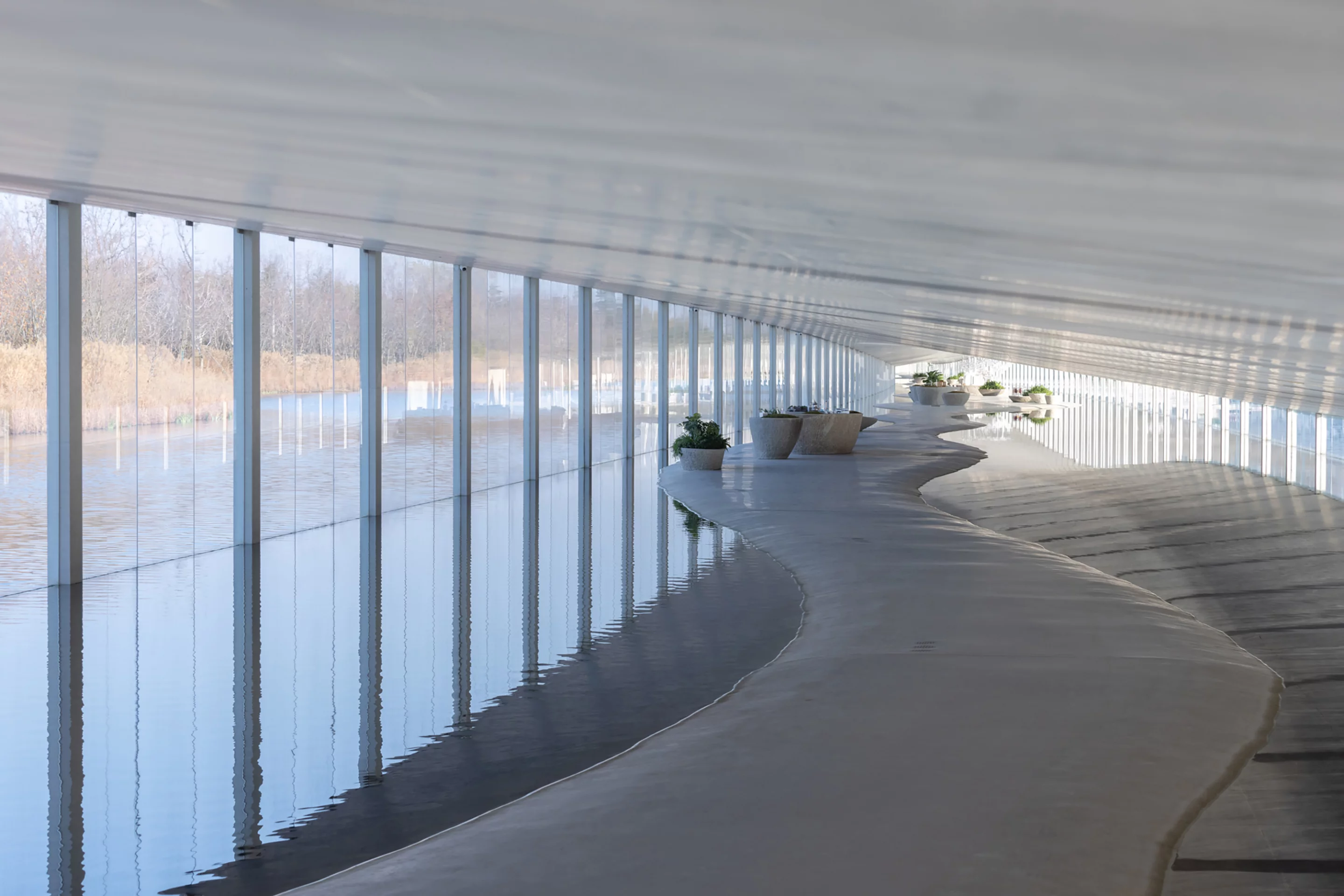 The Zaishui Art Museum lets the lake water inside in multiple areas